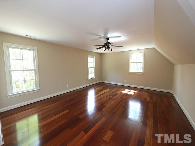 3460 Century Farm Road Wake Forest, NC 27587 - Photo 25 of 25 a view of an empty room with wooden floor and a window