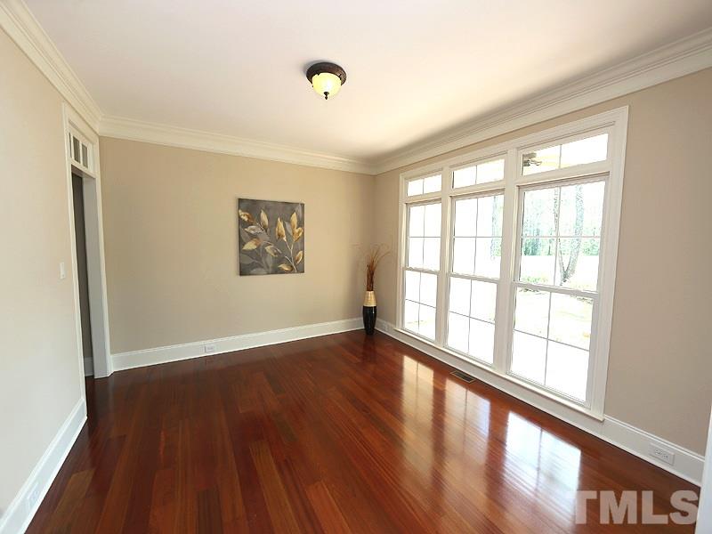 3460 Century Farm Road Wake Forest, NC 27587 - Photo 8 of 25 a view of an empty room with wooden floor and a window