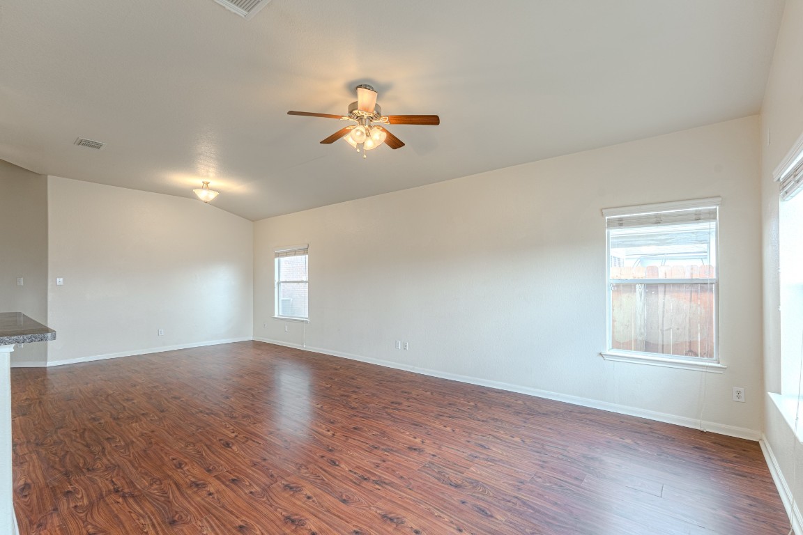 6526 Bella Noche Drive Spring, TX 77379 - Photo 15 of 46 a view of an empty room with a window and wooden floor
