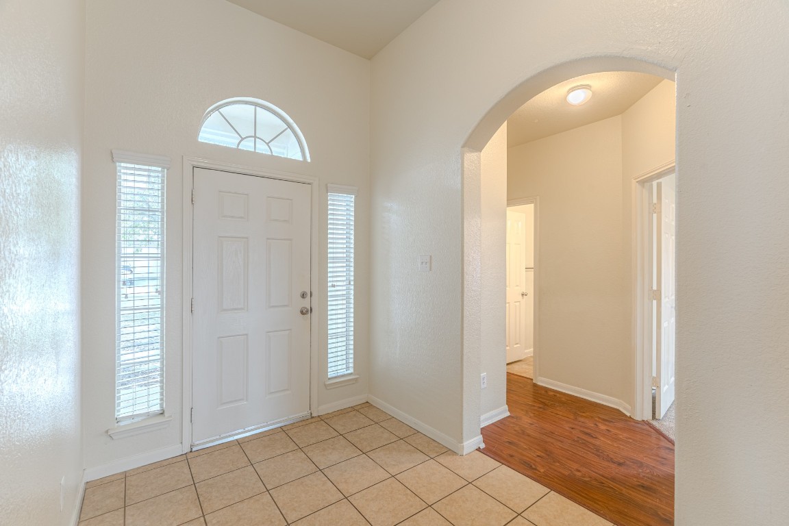 6526 Bella Noche Drive Spring, TX 77379 - Photo 35 of 46 an empty room with wooden floor and windows