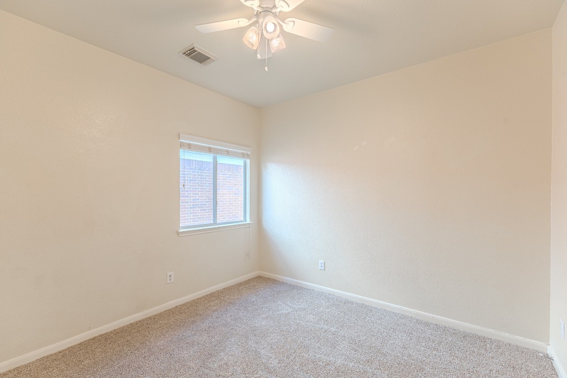6526 Bella Noche Drive Spring, TX 77379 - Photo 36 of 46 an empty room with a window and a fan