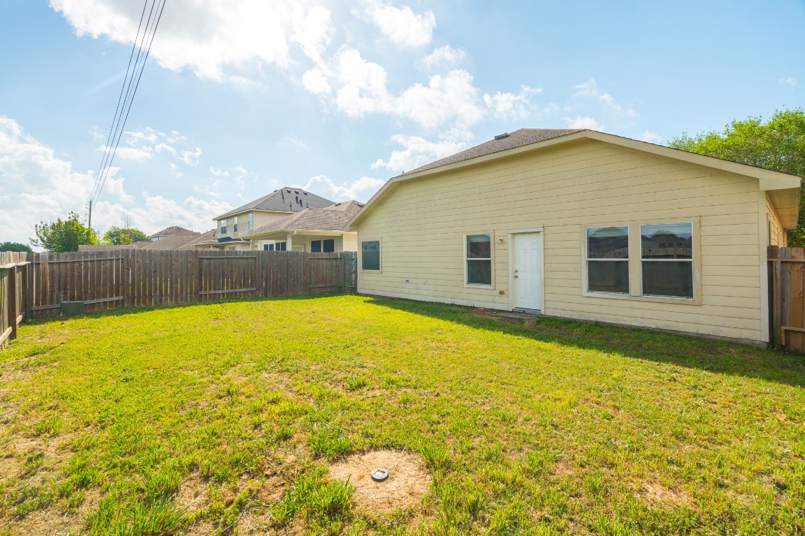 6526 Bella Noche Drive Spring, TX 77379 - Photo 43 of 46 a view of a swimming pool with a yard