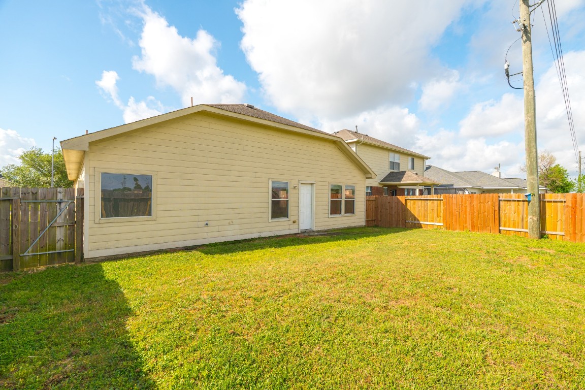 6526 Bella Noche Drive Spring, TX 77379 - Photo 44 of 46 a view of a house with a yard