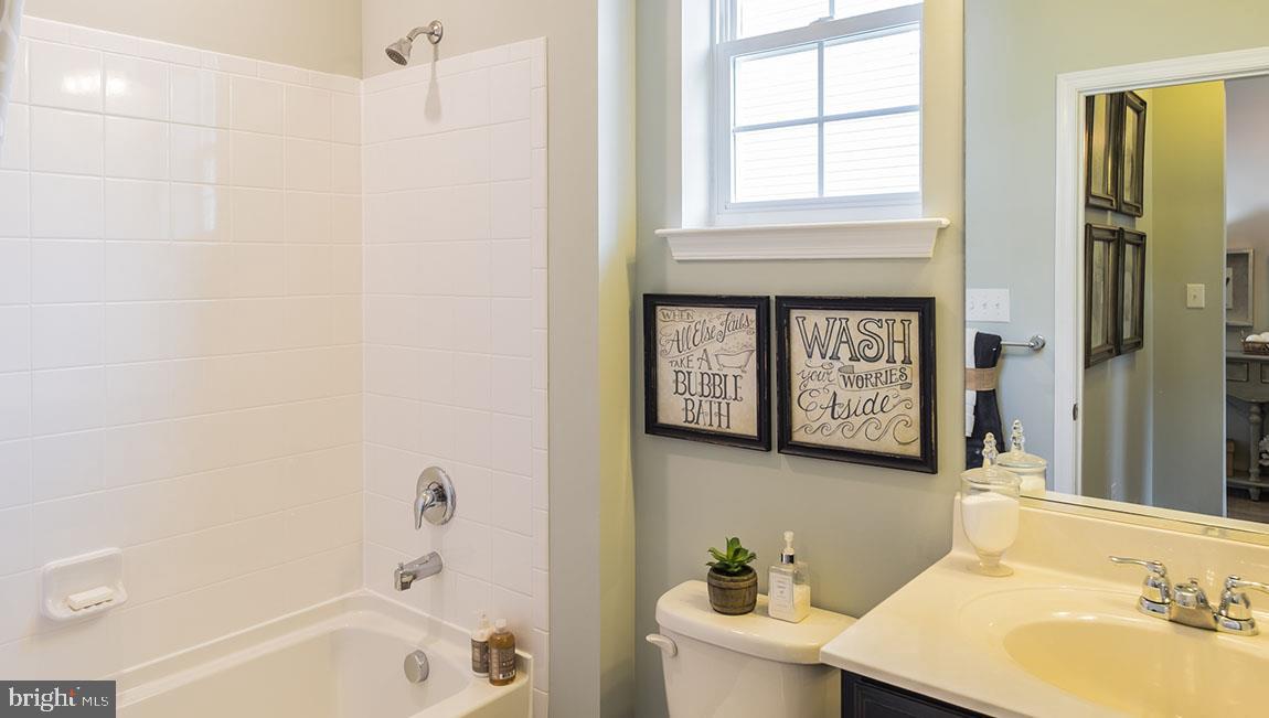 41 Walton Way Delanco, NJ 08075 - Photo 5 of 14 a bathroom with a sink a bathtub and a window