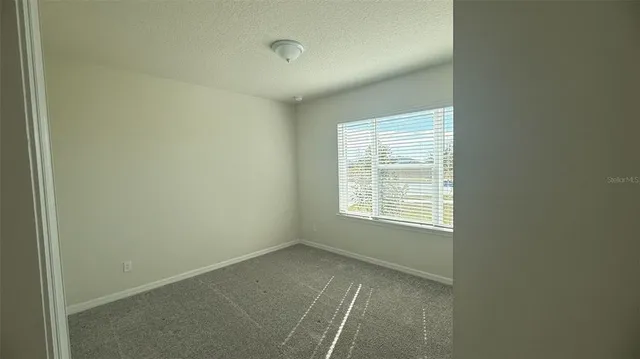 a view of entryway with wooden floor and window