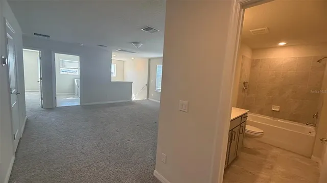 a view of hallway with livingroom