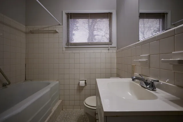 a bathroom with a sink toilet and bathtub