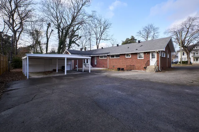 a view of a house with a yard and garage