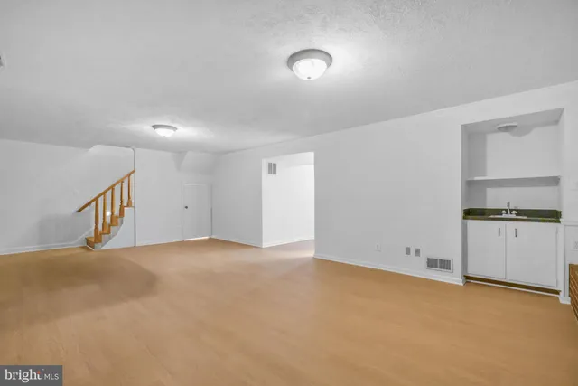 a view of an empty room and a window