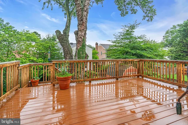 a view of balcony with wooden floor and fence