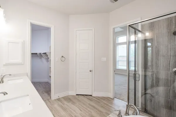 a bathroom with a sink and shower