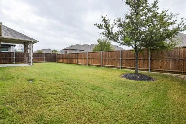 a view of a backyard with a small cabin