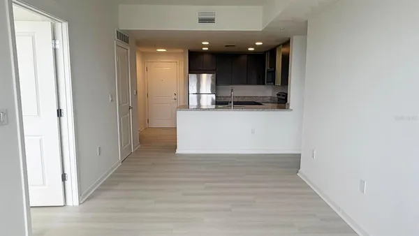 a view of kitchen with stainless steel appliances kitchen island