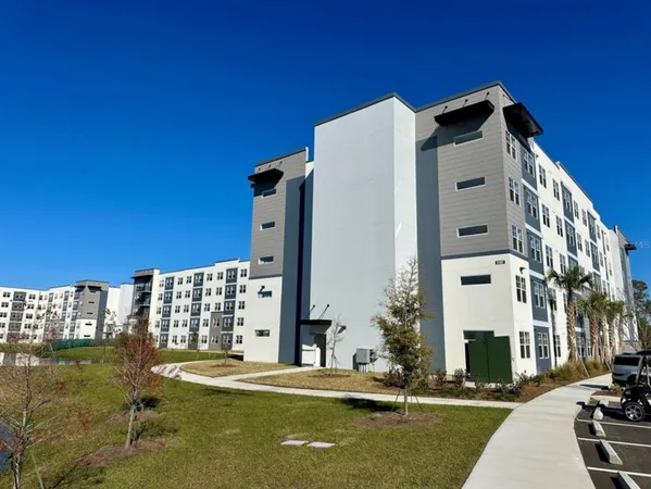 a view of a building with a yard