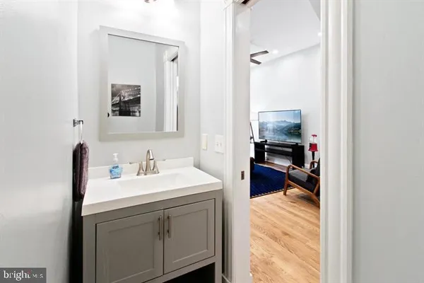 a en suite bathroom with a sink double vanity and a mirror