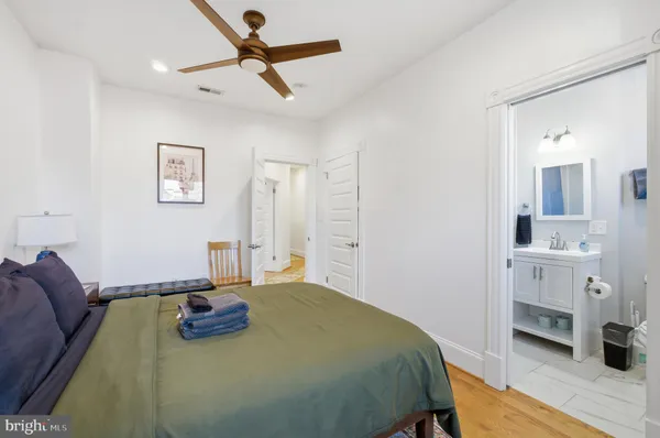 a bedroom with a bed and a table