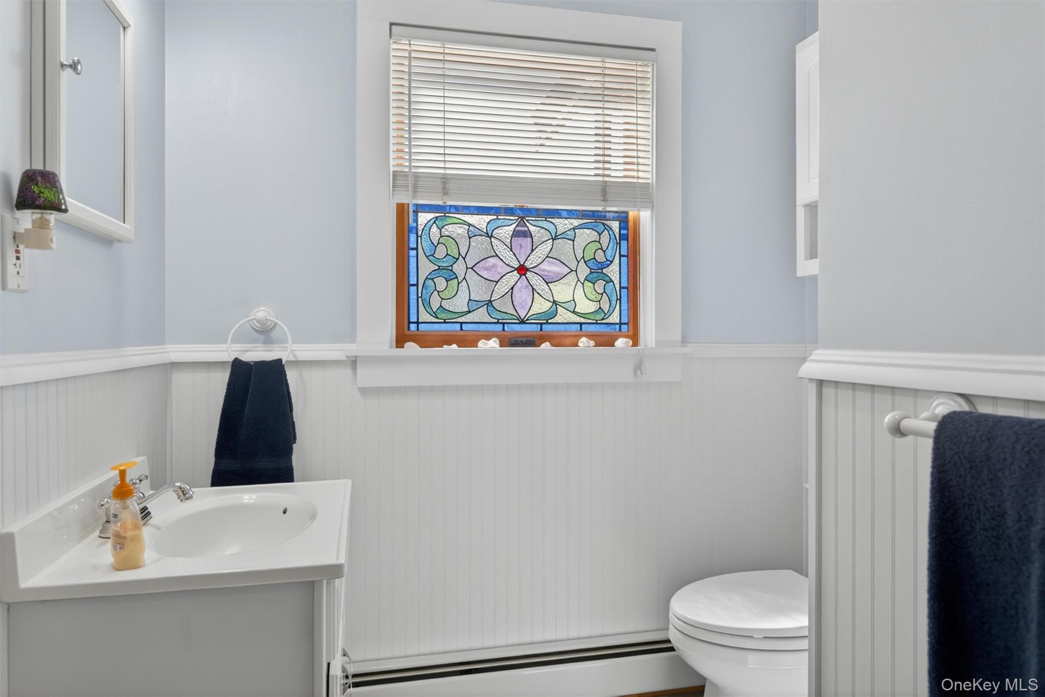340 Hospital Road Callicoon, NY 12723 - Photo 25 of 41 a bathroom with a sink a toilet and a window