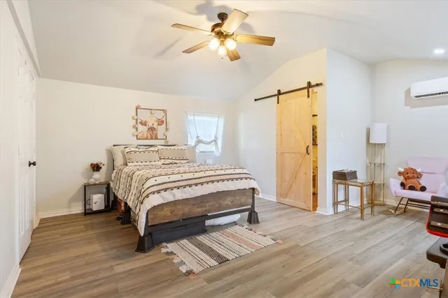 a view of a house with yard and a tree