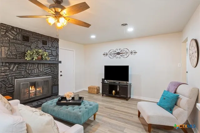 a kitchen with stainless steel appliances a stove microwave and refrigerator