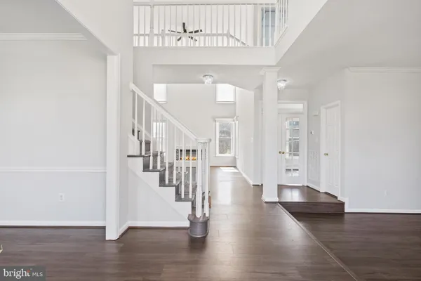 a view of entryway with wooden floor