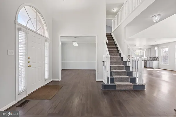 a view of entryway with wooden floor