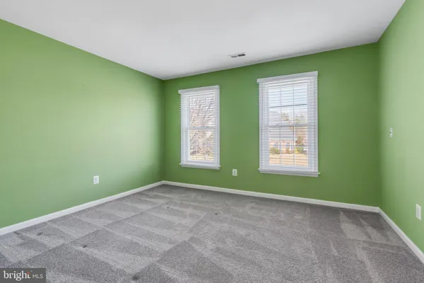 a view of room with window and ceiling fan