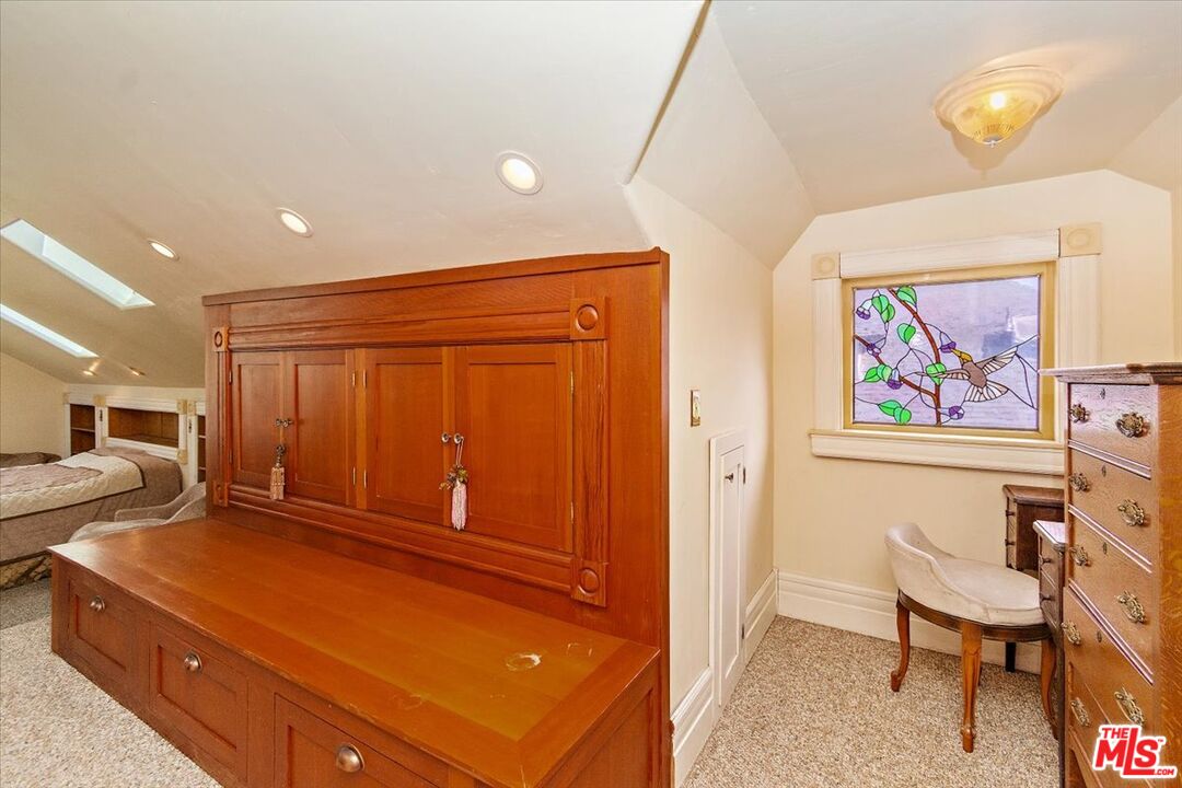 448 North Summit Avenue Pasadena, CA 91103 - Photo 12 of 16 a bedroom with a bed and furniture