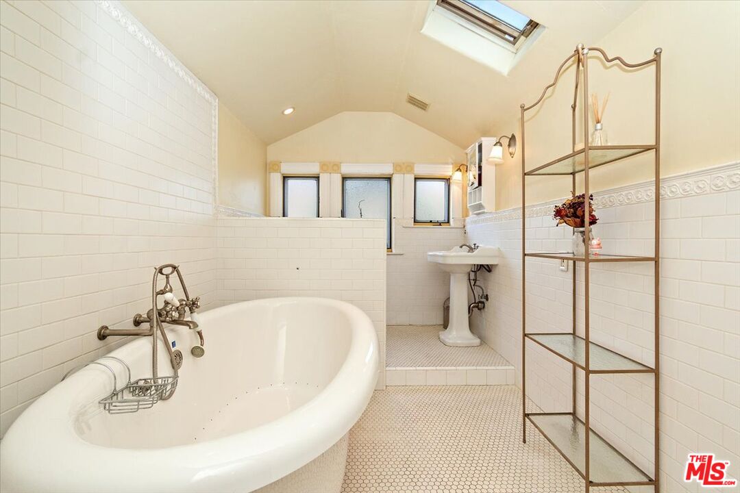 448 North Summit Avenue Pasadena, CA 91103 - Photo 13 of 16 a bathroom with a sink and mirror
