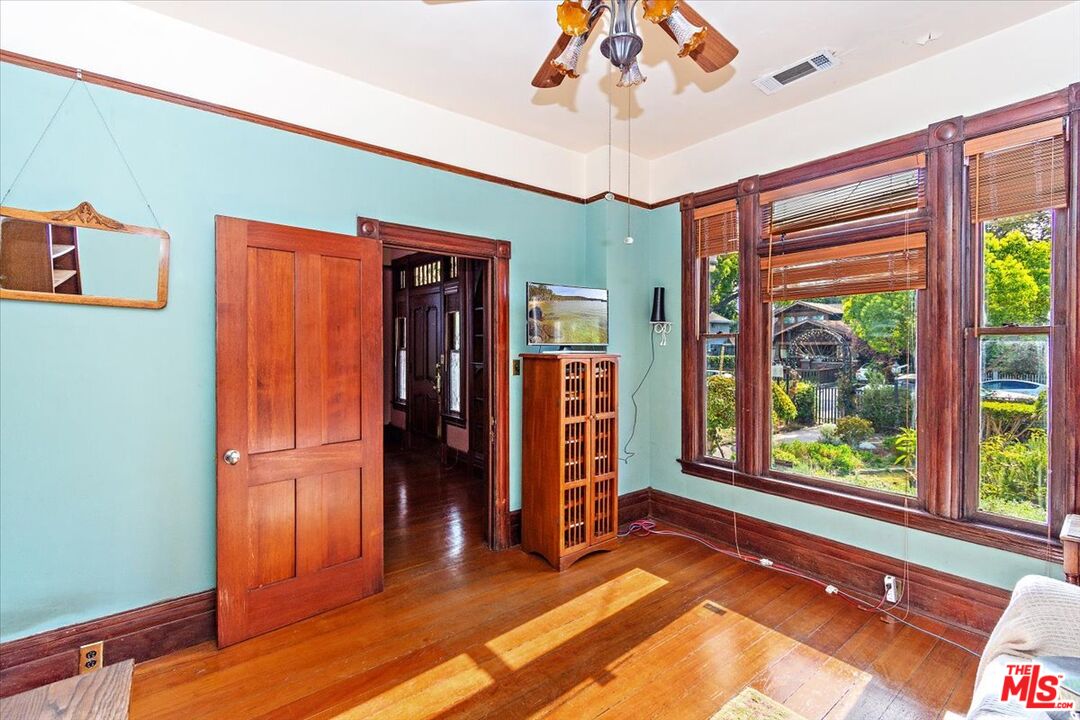 448 North Summit Avenue Pasadena, CA 91103 - Photo 14 of 16 wooden floor in an empty room with a window