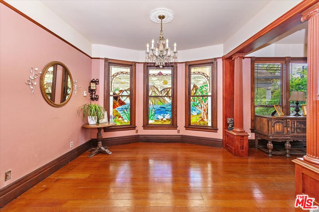 448 North Summit Avenue Pasadena, CA 91103 - Photo 6 of 16 a living room with fireplace furniture and a large window