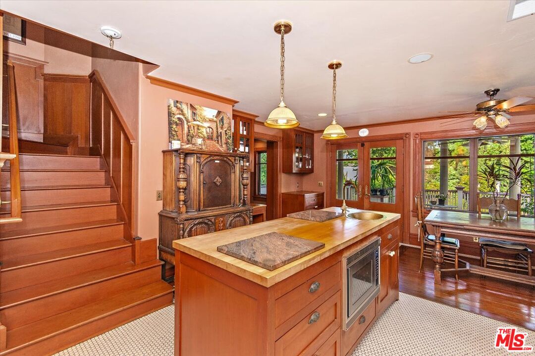 448 North Summit Avenue Pasadena, CA 91103 - Photo 10 of 16 a kitchen that has a sink stove and cabinets