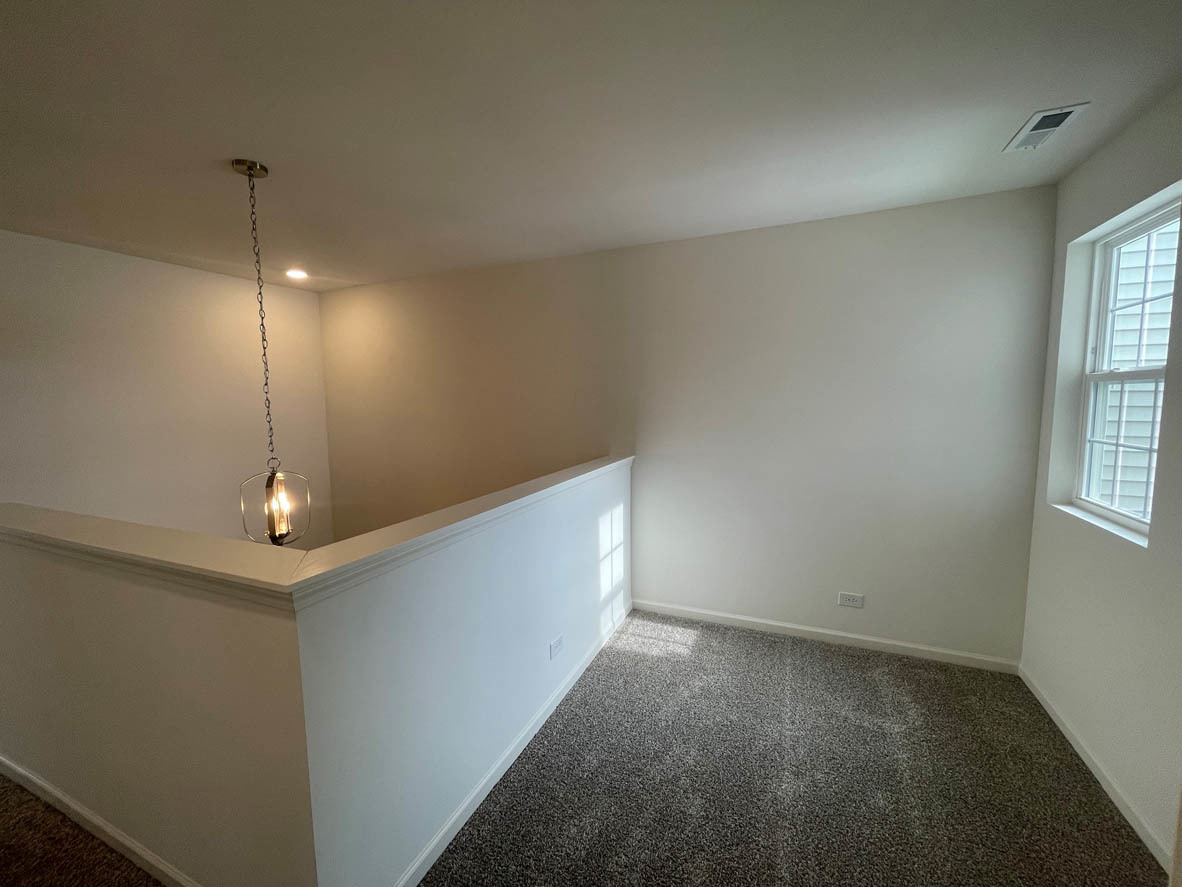 778 Westbury Drive Cary, IL 60013 - Photo 12 of 29 a view of a room with window and stairs