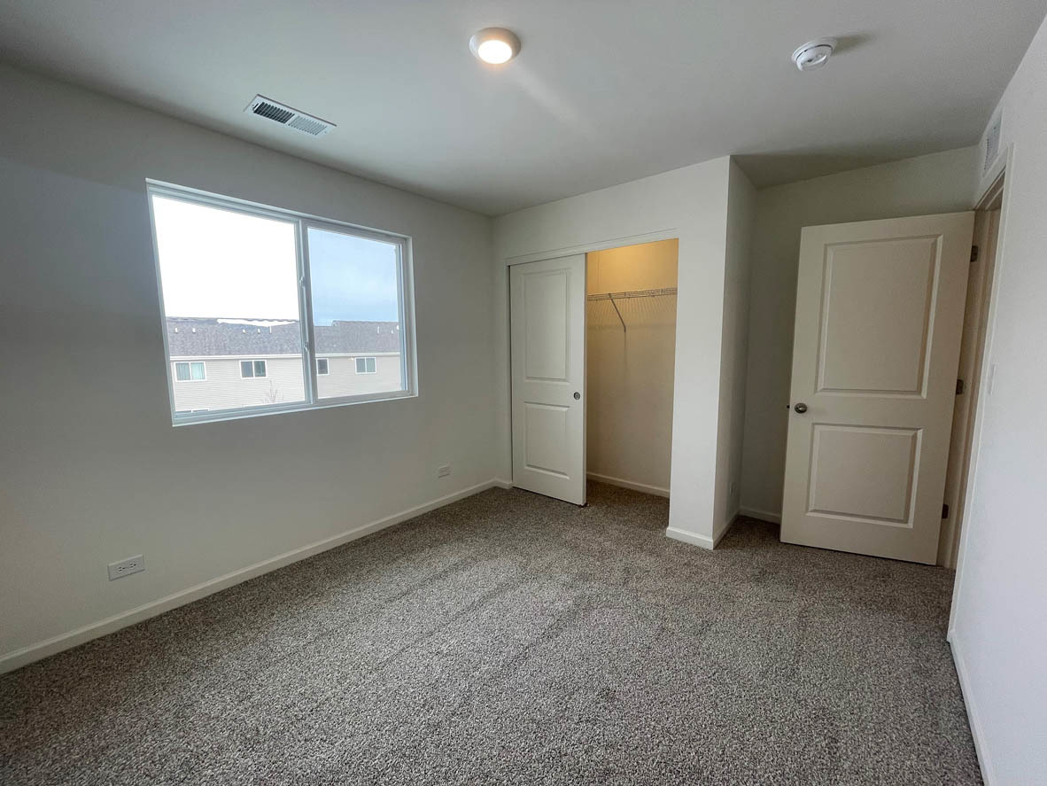 778 Westbury Drive Cary, IL 60013 - Photo 19 of 29 an empty room with windows and closet