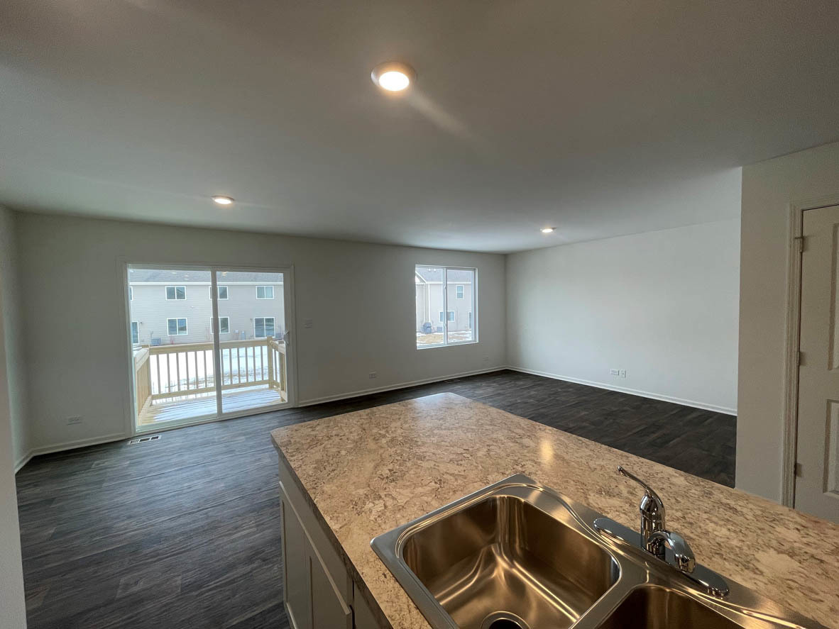 778 Westbury Drive Cary, IL 60013 - Photo 5 of 29 a view of a kitchen with a sink and dishwasher wooden floor