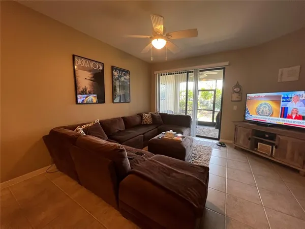 a living room with furniture and a window