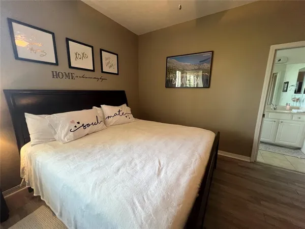 a living room with furniture and a dining table