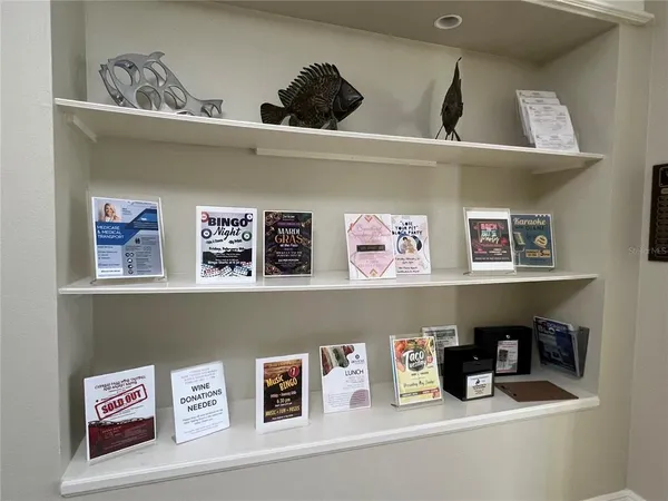 a view of a patio with a table and chairs under an umbrella