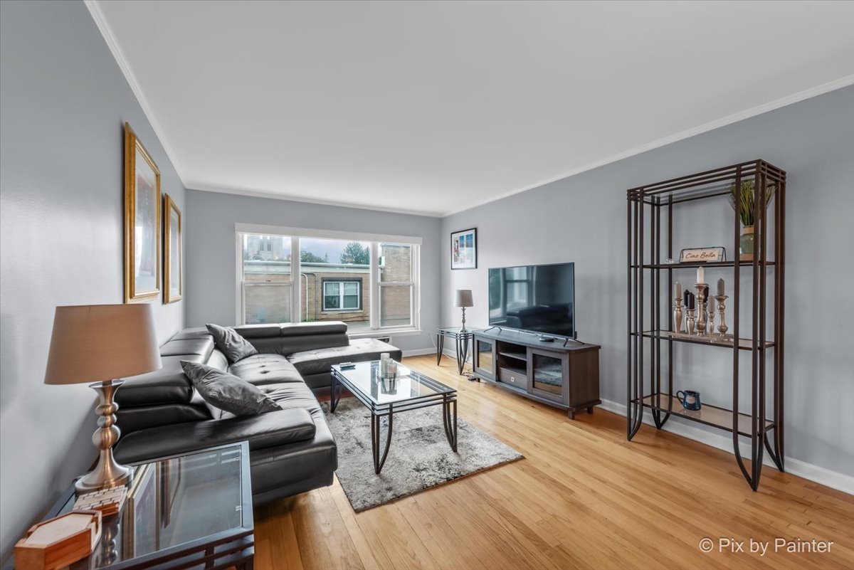 7211 Division Street, Unit C2 River Forest, IL 60305 - Photo 2 of 22 a living room with furniture and a flat screen tv