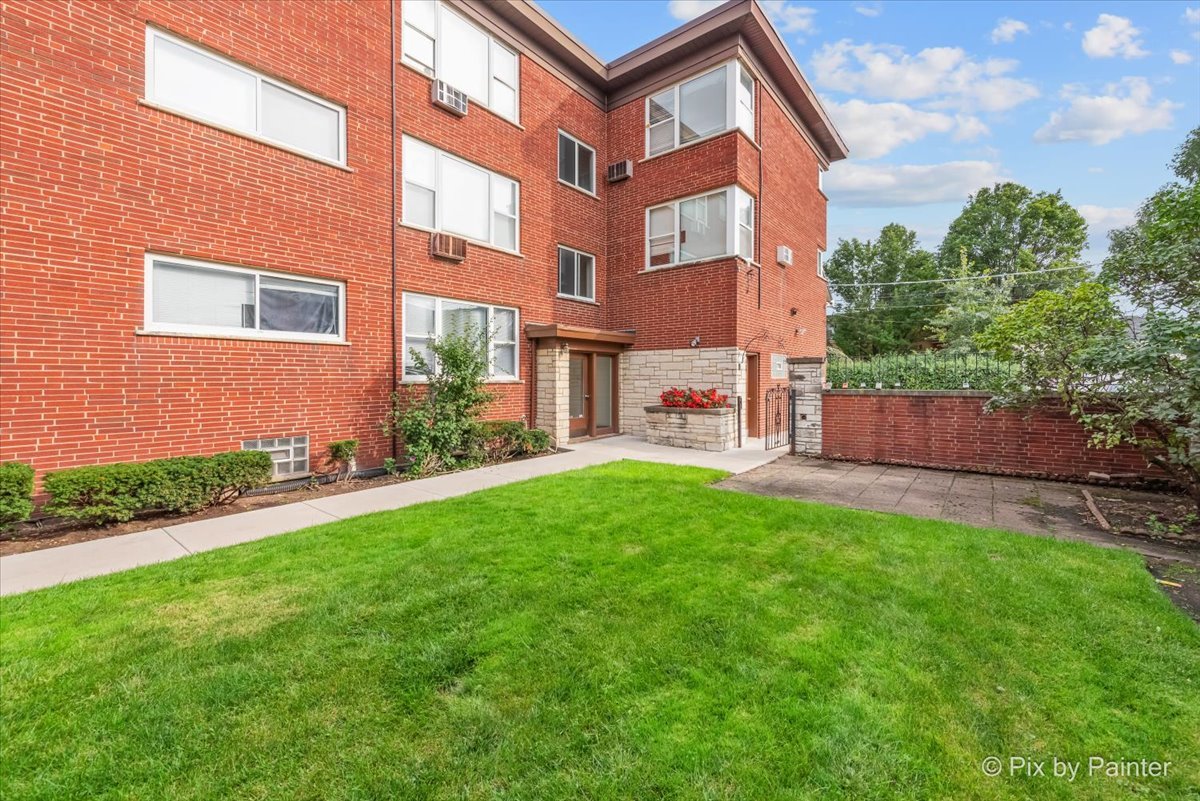 7211 Division Street, Unit C2 River Forest, IL 60305 - Photo 21 of 22 a brick building with a yard in front of it