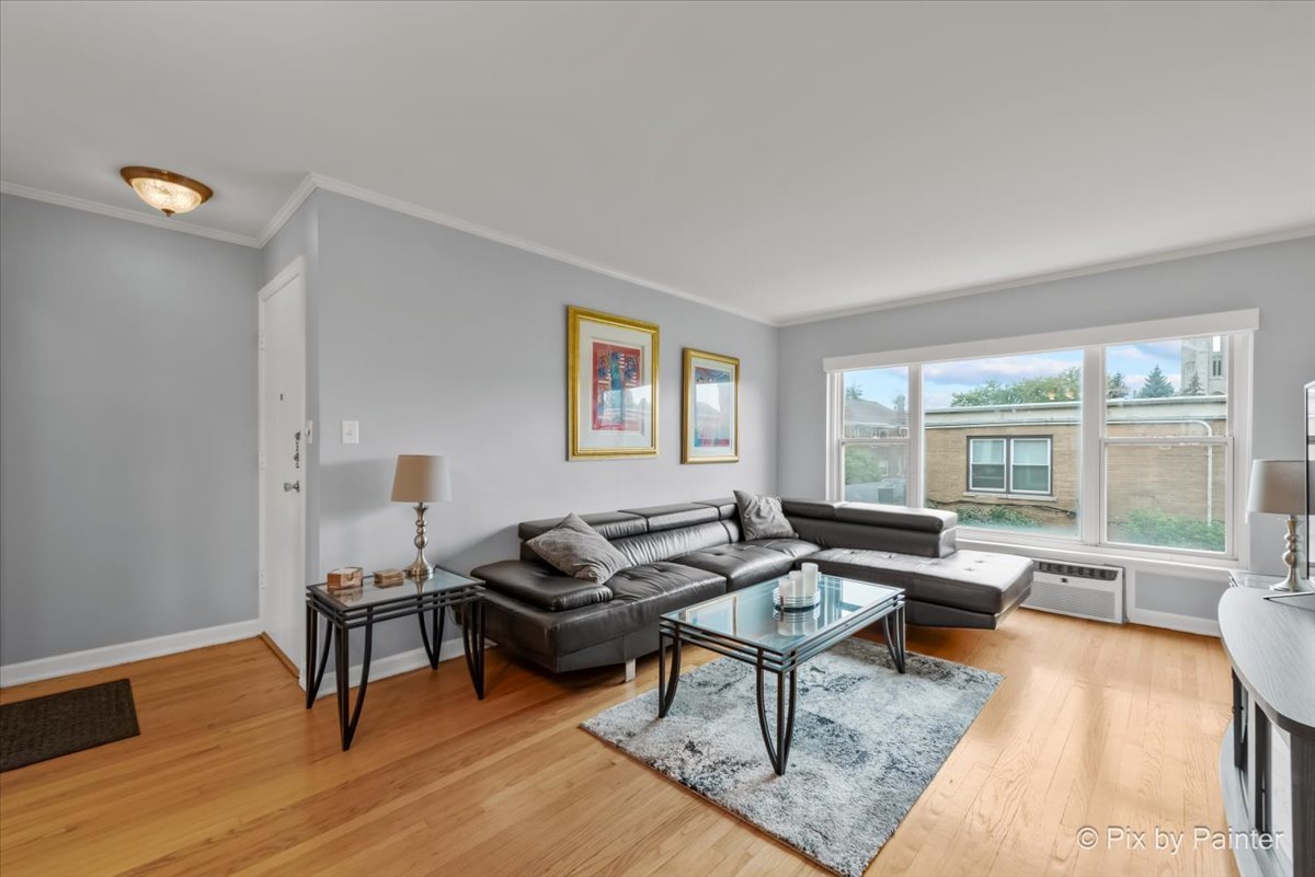 7211 Division Street, Unit C2 River Forest, IL 60305 - Photo 3 of 22 a living room with furniture and a wooden floor