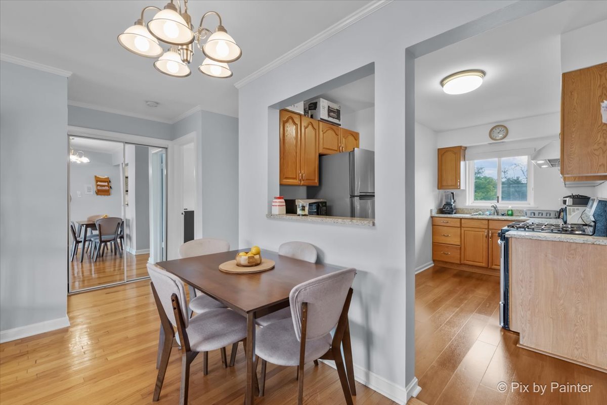 7211 Division Street, Unit C2 River Forest, IL 60305 - Photo 5 of 22 a view of a dining room with furniture and wooden floor