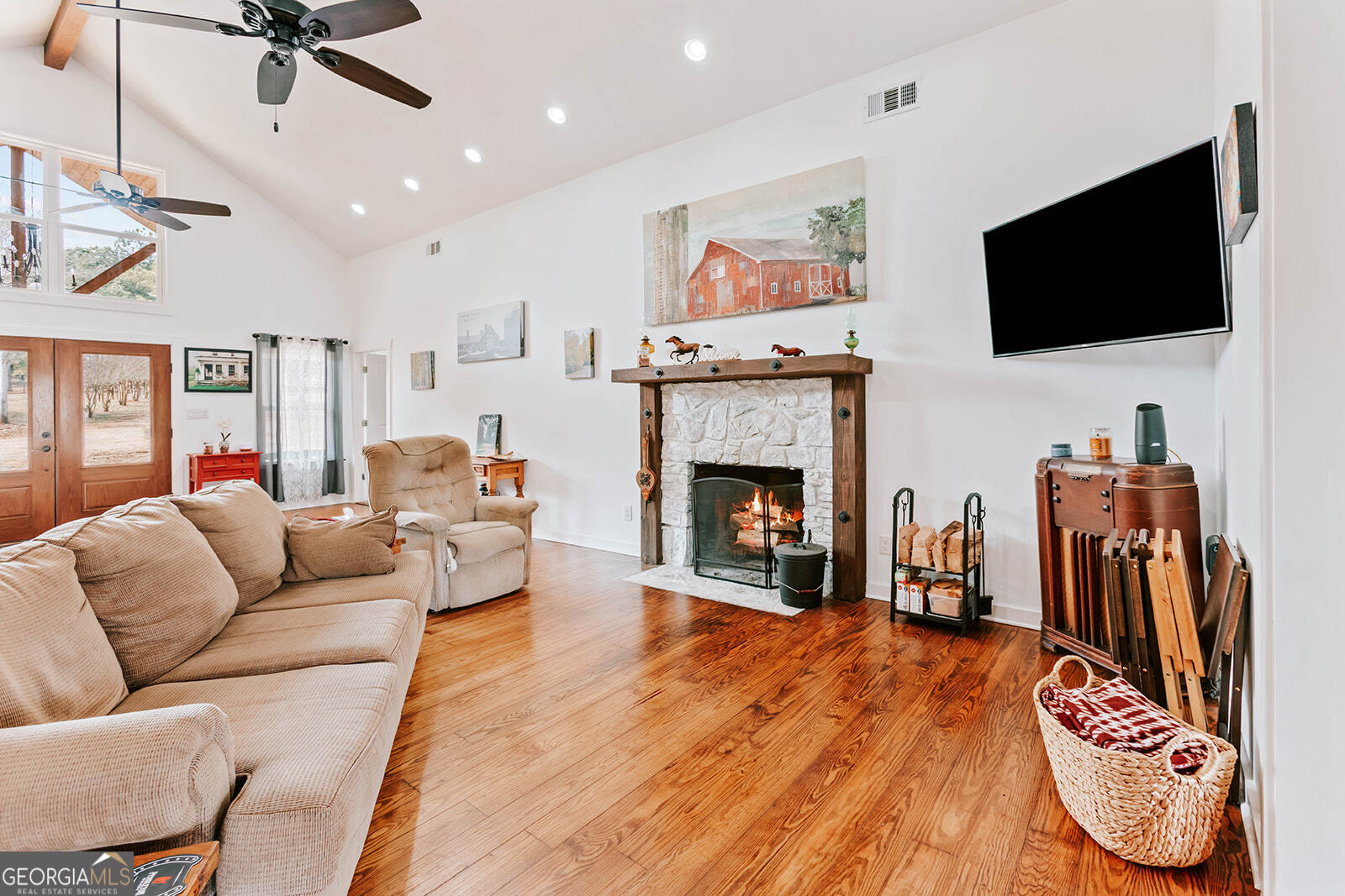 2820 Davis Academy Road Rutledge, GA 30663 - Photo 13 of 65 a living room with furniture fireplace and flat screen tv