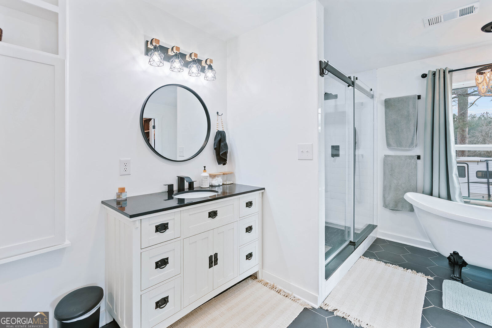 2820 Davis Academy Road Rutledge, GA 30663 - Photo 20 of 65 a bathroom with a sink a toilet and a mirror