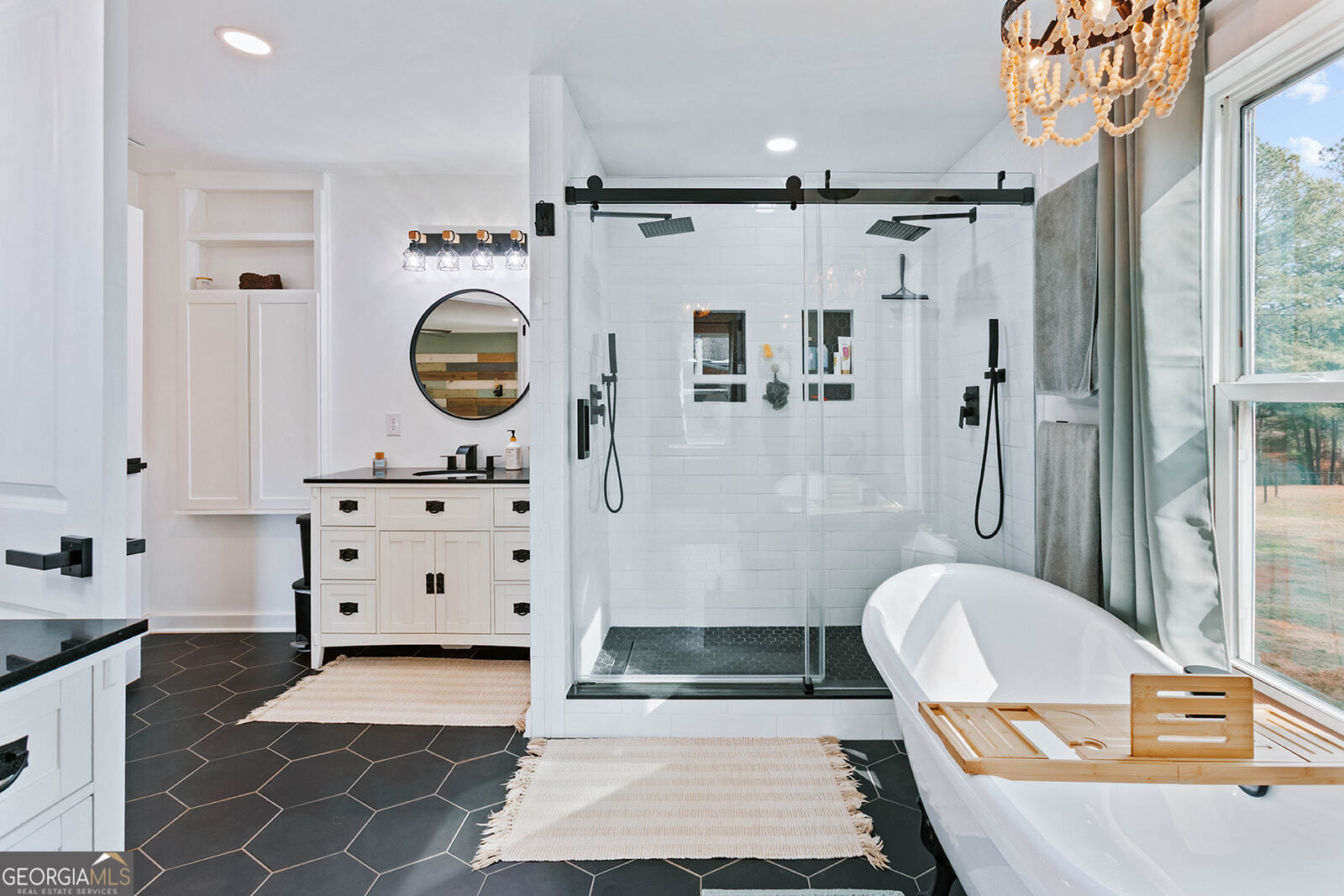 2820 Davis Academy Road Rutledge, GA 30663 - Photo 22 of 65 a bathroom with a sink a toilet and shower