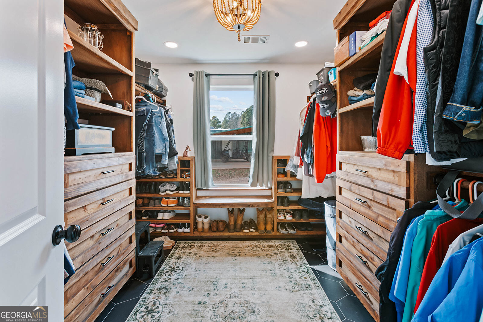 2820 Davis Academy Road Rutledge, GA 30663 - Photo 23 of 65 a view of walk in closet with clothes and shoes