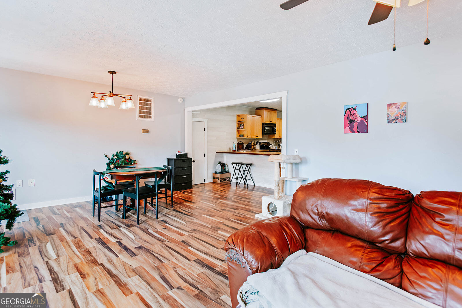 2820 Davis Academy Road Rutledge, GA 30663 - Photo 31 of 65 a living room with furniture and a dining table
