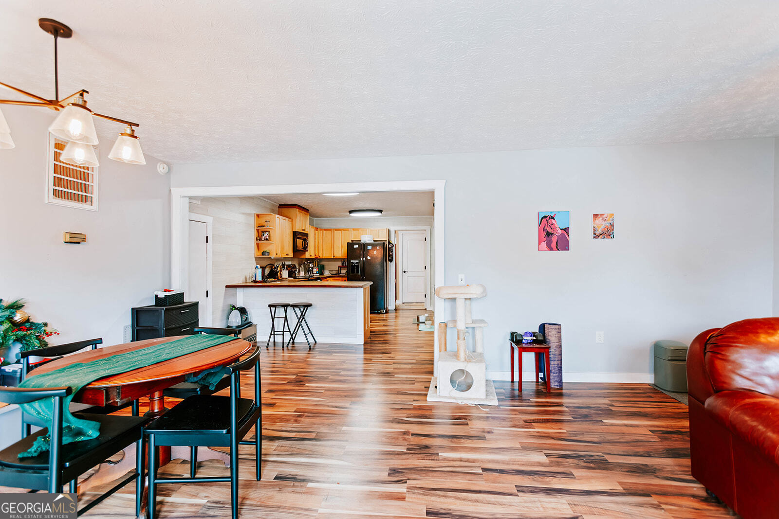 2820 Davis Academy Road Rutledge, GA 30663 - Photo 32 of 65 a living room with furniture and wooden floor