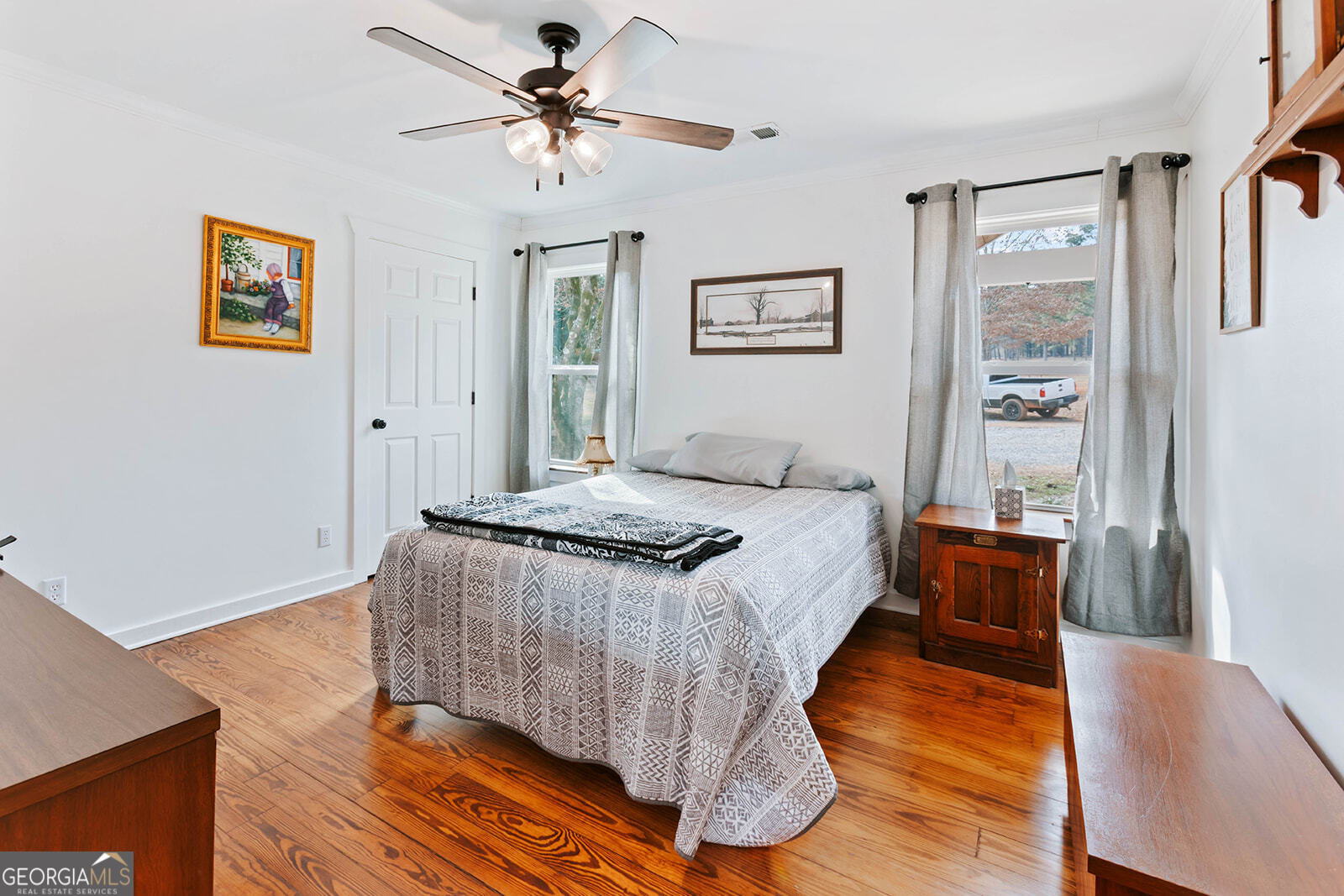 2820 Davis Academy Road Rutledge, GA 30663 - Photo 39 of 65 a bed room with a bed and a chandelier