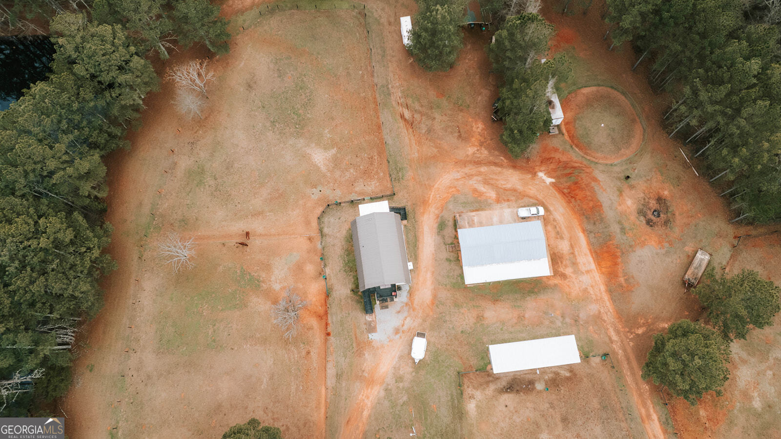 2820 Davis Academy Road Rutledge, GA 30663 - Photo 54 of 65 an aerial view of a house with a yard and large trees