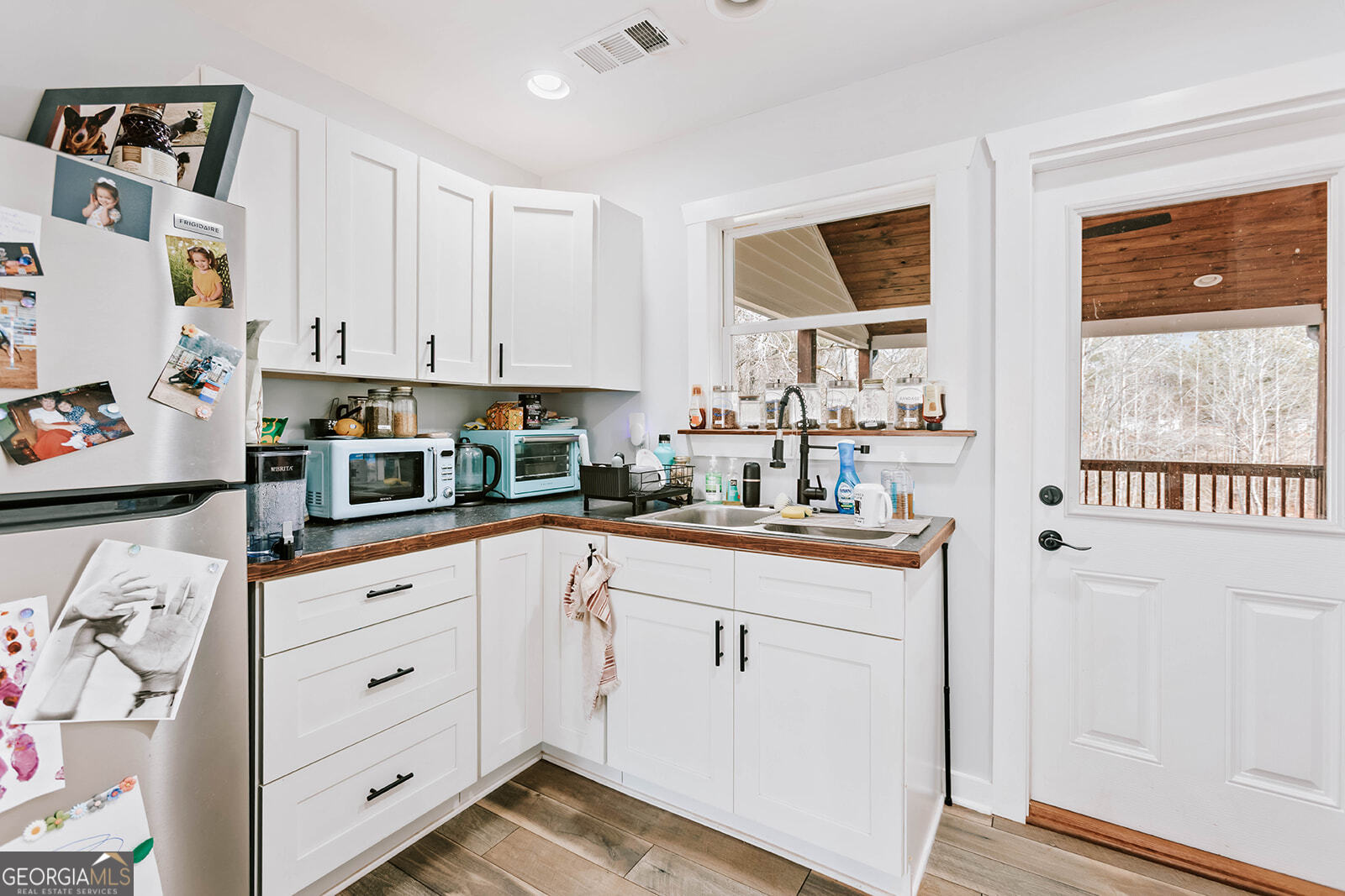 2820 Davis Academy Road Rutledge, GA 30663 - Photo 59 of 65 a kitchen with cabinets appliances and a window